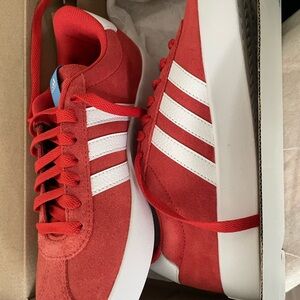 Red Adidas size 7.  Brand New never worn.